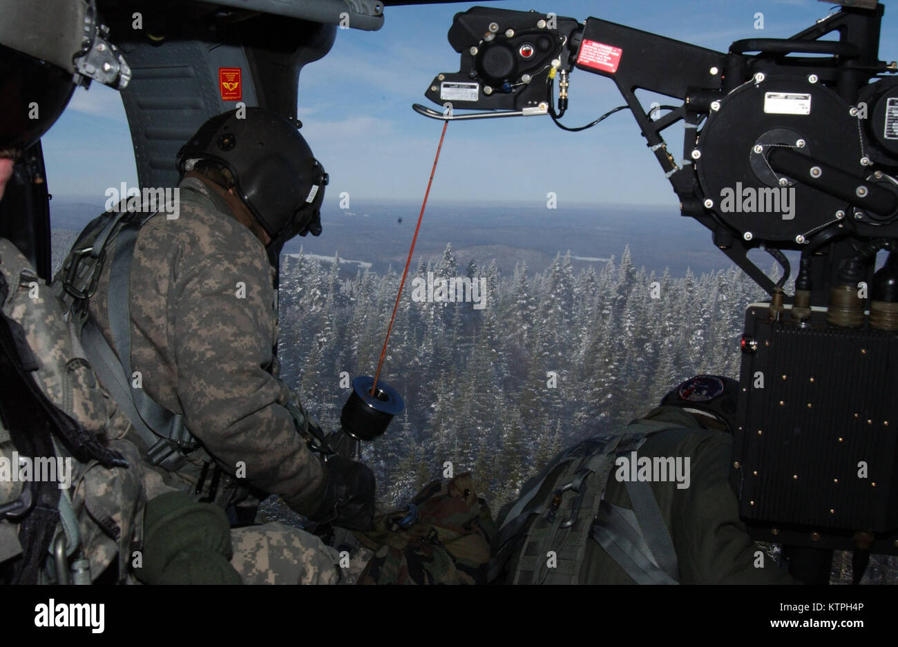 Military helicopter winch crew Stock Photo Alamy