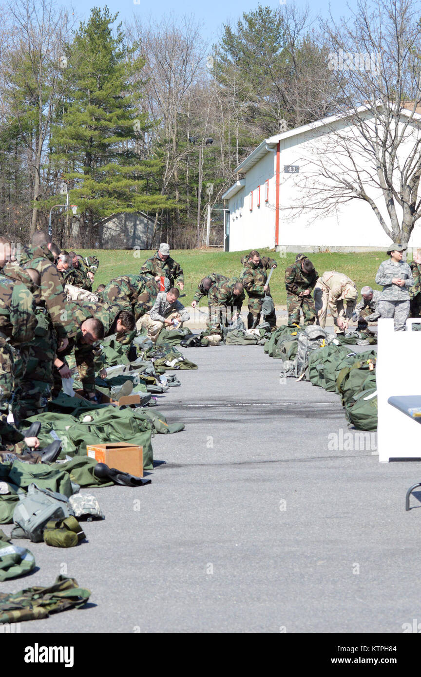 Airmen begin the hands-on chemical, biological, radiological and nuclear training at Stratton Air National Guard Base, New York, on April 18, 2015. The training was part of the 109th Airlift Wing's first ancillary training rodeo where more than 200 Airmen were trained on CBRN as well as self-aid and buddy care. (U.S. Air National Guard photo by Tech. Sgt. Catharine Schmidt/Released) Stock Photo