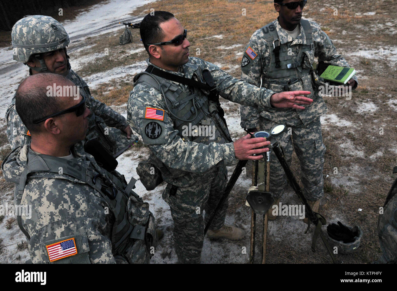 1st Sgt. Romulo. Battery B, 258th Field Artillery checks the difference