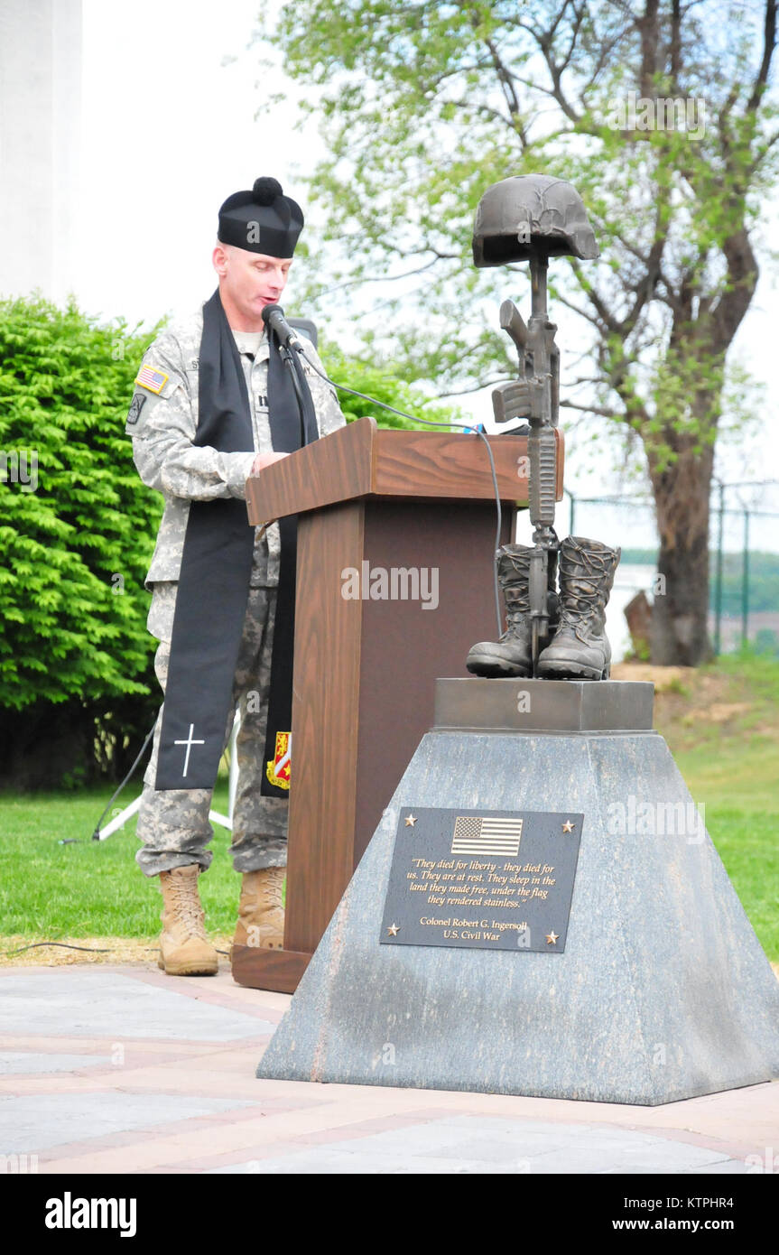 New York Army National Guard Chaplain (Captain) Anthony Stevens delivers the invocation marking the opening of the New York State Division of Military and Naval Affairs pre-Memorial Day ceremony conducted on Thursday, May 21, 2015 at Division of Military and Naval Affairs headquarters in Latham, N.Y. More than 200 New York National Guard members and Division of Military and Naval Affairs employees gathered to dedicate the new New York Military Forces Memorial, commemorating the sacrifice ofall members of the New York National Guard, the New York Naval Militia and the New York Guard in all conf Stock Photo
