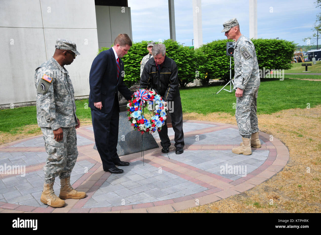 New York Army National Guard Command Sgt. Major Louis Wilson (left); Mr. Terrence O'Leary, New York State Deputy Secretary for Public Safety; Mr. Ray Sestak, veterans advocate; and Major General Patrick Murphy, the Adjutant General of New York present a wreath at the New York Military Forces Memorial outside Division of Military and Naval Affairs Headquarters during a pre-Memorial Day remembrance ceremony on Thursday, May 21. Members of the New York National Guard and Division of Military and Naval Affairs employees memorialized the 33 National Guard members who died in combat since  2001. ( U Stock Photo