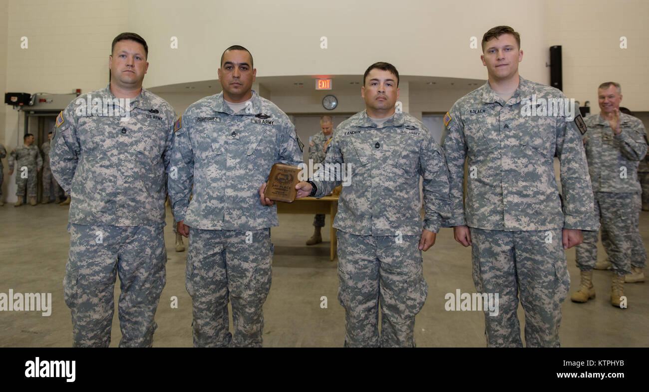 Sgt. 1st Class Brian Manny, Staff Sgt. Ramon Rodriguez, Sgt. 1st Class Robert Landry, and Sgt. John Kolach, of Joint Force Headquarters, pose after receiving 3rd place for overall team at the annual New York TAG Combat Sustainment Training Exercise on May 31, 2015, at Camp Smith, N.Y.  The exercise is an annual three day event that tests individuals and teams against each other in rifle and pistol shooting matches. (N.Y. Army National Guard photo by Sgt. Harley Jelis/ Released) Stock Photo