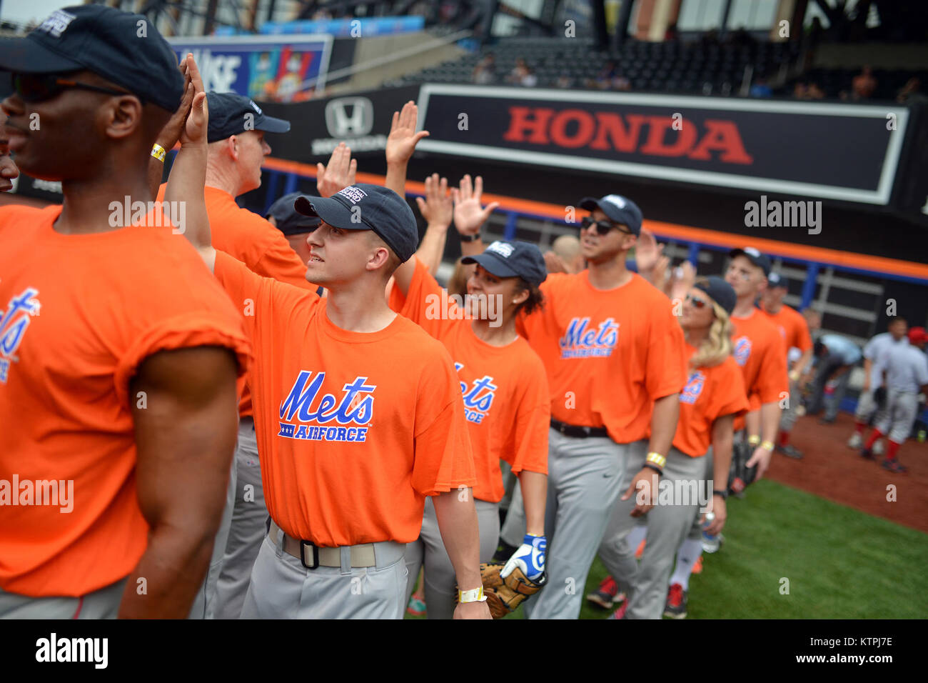 NEW YORK, NY - Wearing New York Mets jerseys, service members from the Air  Force, Army, Marines and Navy play a tournament style softball game at  Citifield on June 11, 2015. The