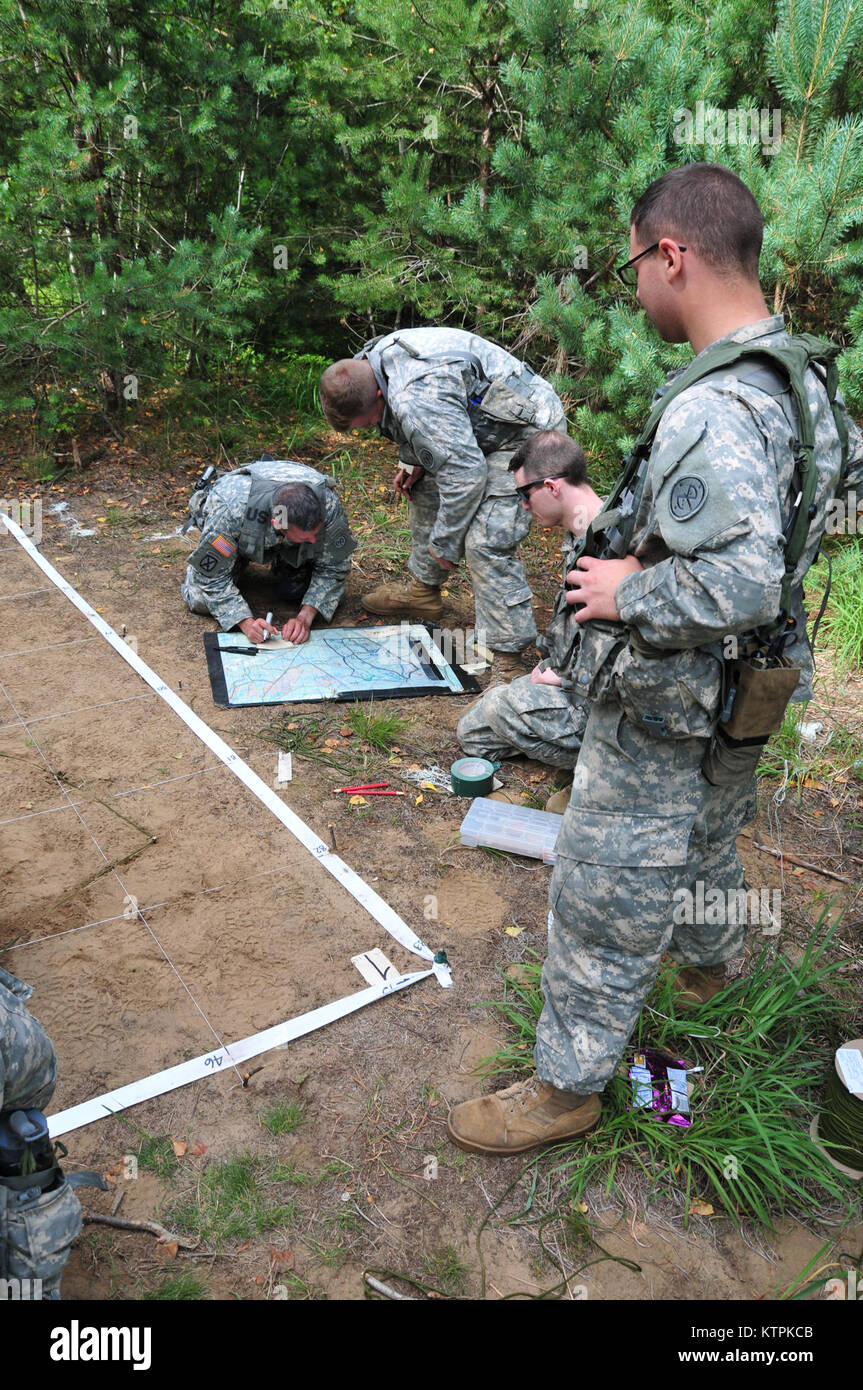 FORT DRUM, N.Y. – Members of 1st Battalion, 182nd Infantry Regiment, Massachusetts Army National Guard, prepare a sand table while training with the 27th Infantry Brigade Combat Team during the 27th’s XCTC (Exportable Combat Training Capabilities) exercise July 12-31. The 182nd is being aligned for training with the 27th as an add-on unit for next year. The 182nd will join the 27th next year at the Joint Readiness Training Center at Fort Polk, La.  (U.S. National Guard photo by Sgt. 1st Class Steven Petibone, 42nd Infantry Division.) Stock Photo