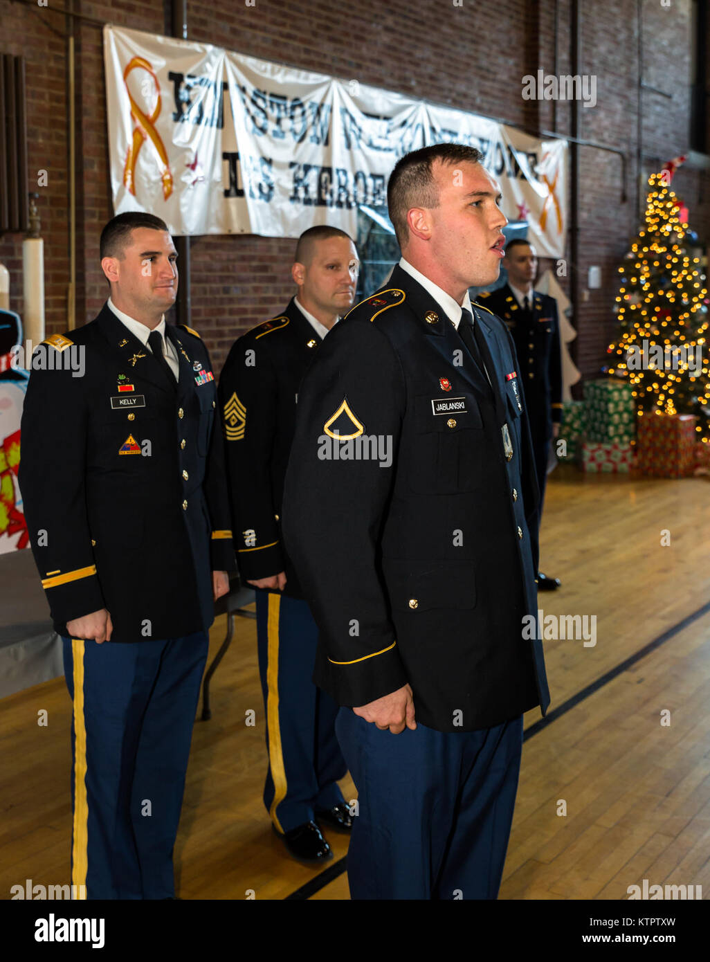 Soldiers from the 1156th Engineer Co. celebrate at their annual holiday party Dec. 5, 2015, in Kingston, NY. (New York Army National Guard photo by Sgt. Harley Jelis/Released) Stock Photo