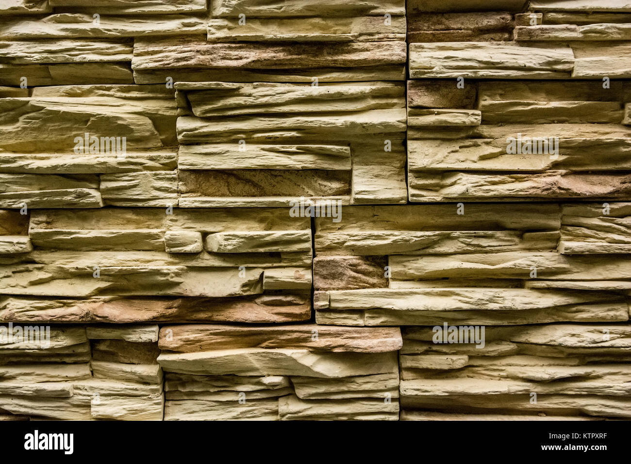 Closeup of beige rough uneven actique stone wall Stock Photo - Alamy