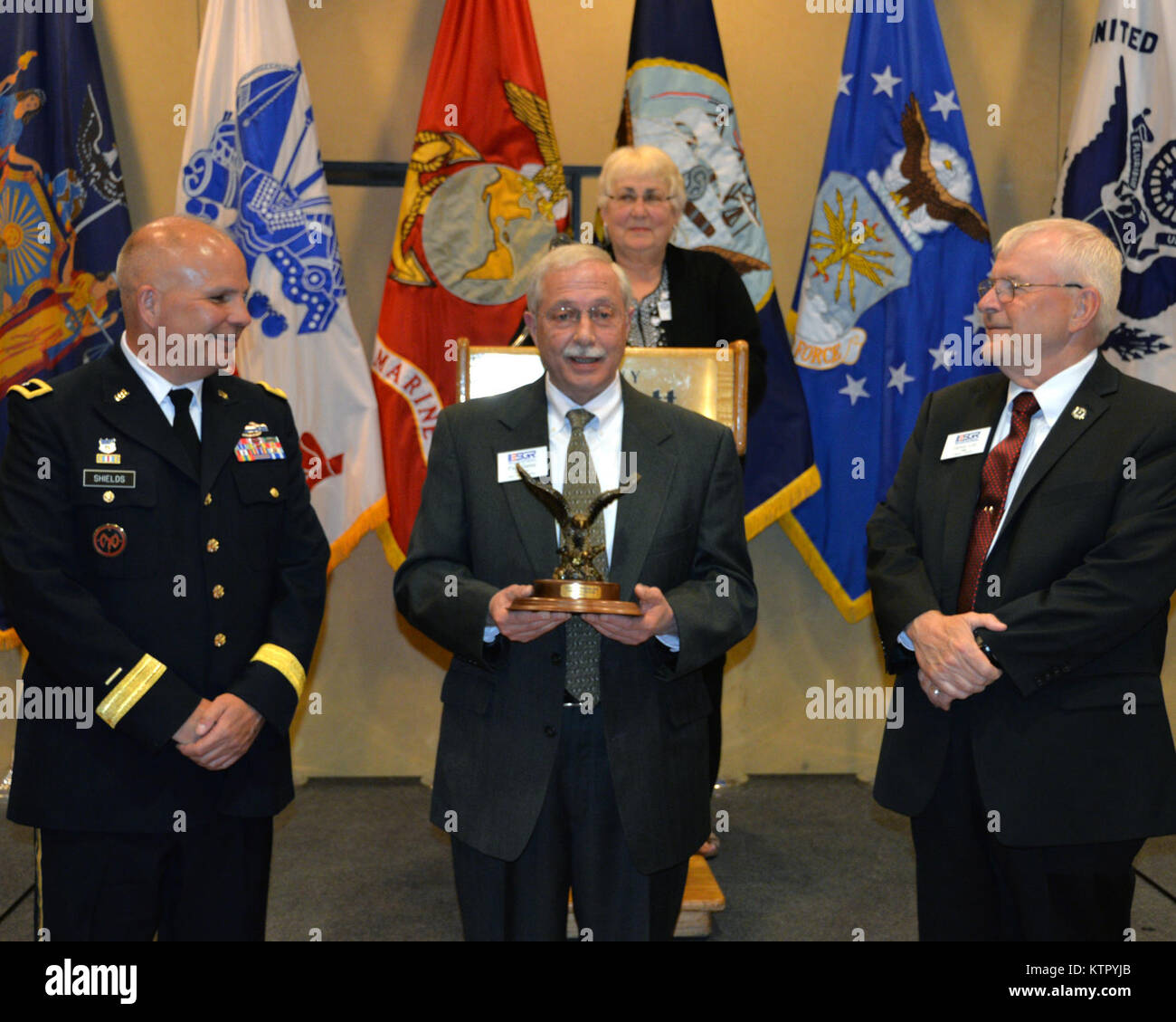 New York Army National Guard Commander Brig. Gen. Raymond Shields and New York State Employer Support of the Guard and Reserve Chairman Maj. Gen. (Ret.) Dennis Lutz present the ESGR’s Spirit of ESGR Award to Paul Geiss (center), a volunteer from central New York during the ESGR 2016 Awards Banquet in Albany, Apr. 26.  The Spirit of ESGR Award is presented to a volunteer who exemplifies the program and who has displayed the highest level of volunteer service. (U.S. Army National Guard photo by: Sgt. Major Corine Lombardo/RELEASED) Stock Photo