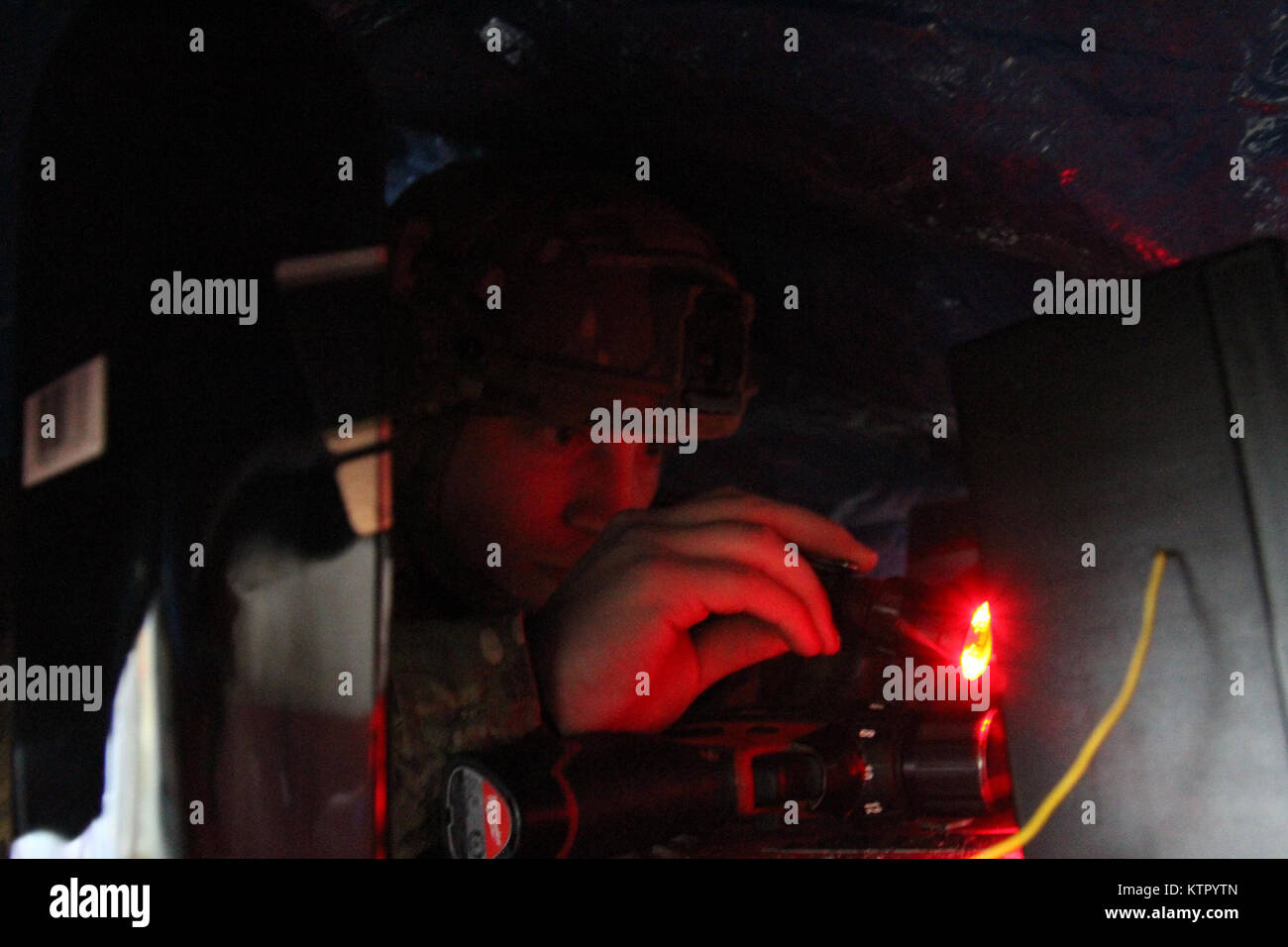 Senior Airman Cody Grassie of the Dover Air Force Base Explosive Ordnance Disposal team examines
