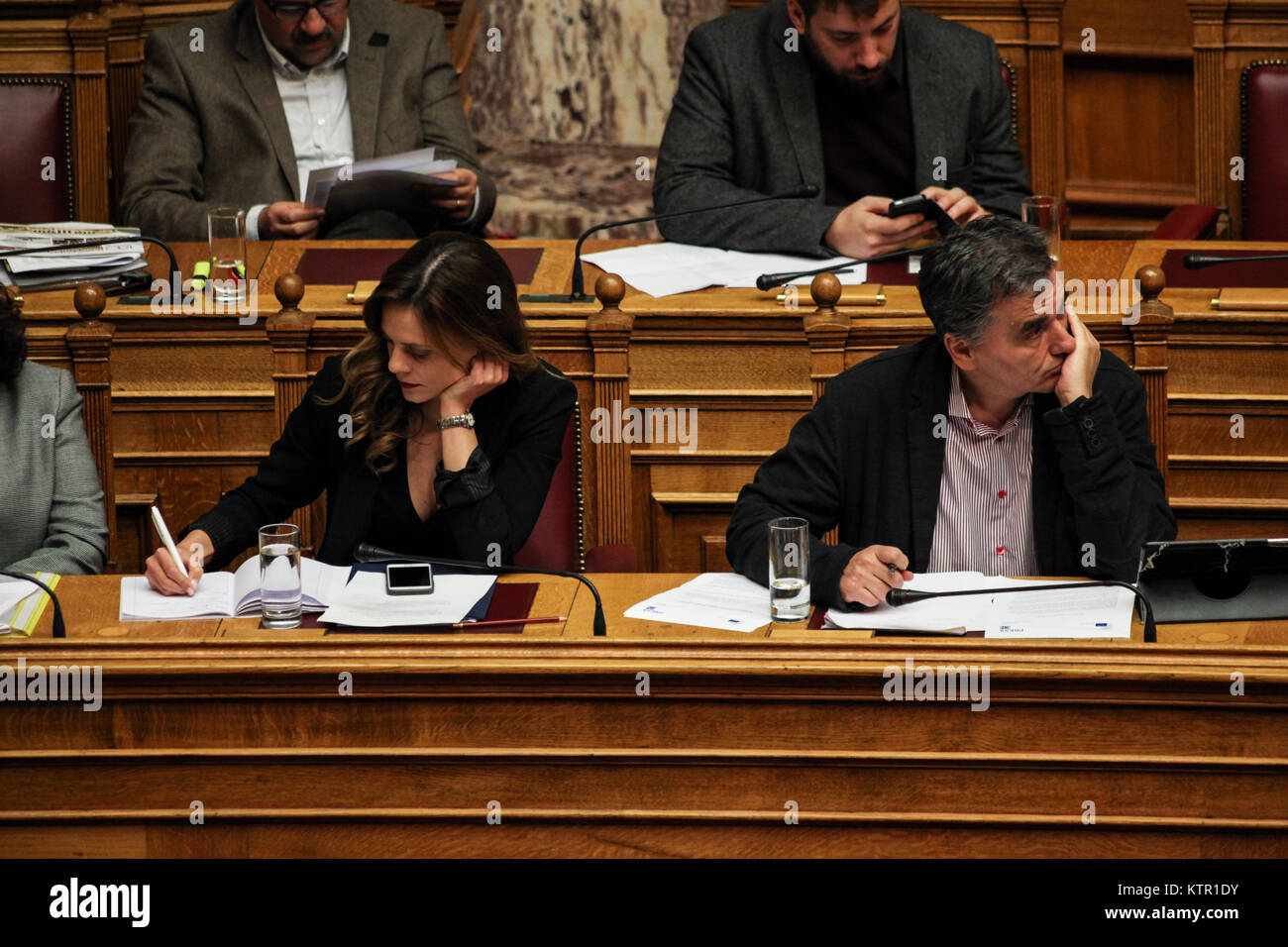 Efi Achtsioglou, the Greek minister of Labour, at the left, and Euclid Tsakalotos, the Greek minister of Finance at the right, at the Greek Parliament. Stock Photo