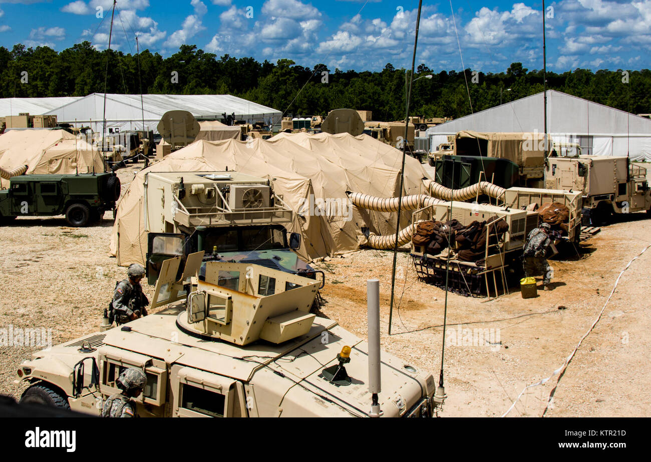 New York Army National Guard Soldies from the 27th Infantry Bridage Combat Team, Headquarters Co., Syracuse, N.Y., perform operator maintenance for unit equipment outside their command post during the Army’s Joint Readiness Training Center, Fort Polk, La., Wednesday, July 20, 2016. More than 3,000 New York Army National Guard Soldiers deployed for a three week exercise at the Army’s Joint Readiness Training Center, July 9-30, 2016. (U.S. Army National Guard photo by Capt. Amy Hanna) Stock Photo