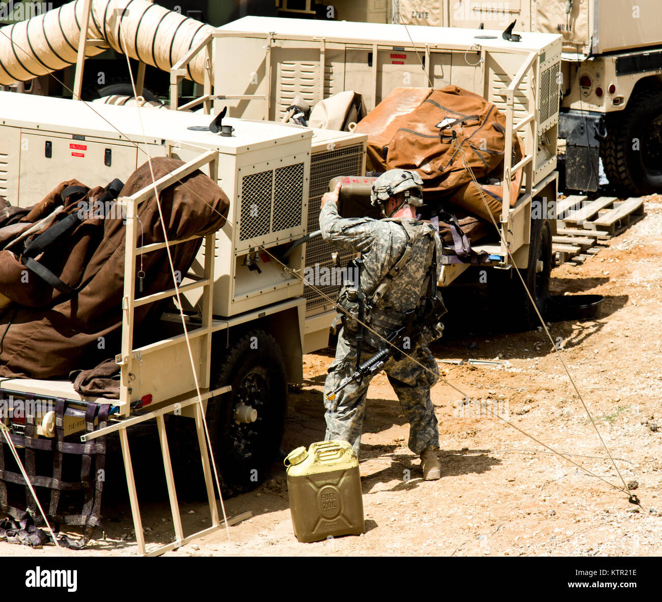 New York Army National Guards Staff Sgt. Jason Ebling, a psychological operations specialist fuels a generator  during the Army’s Joint Readiness Training Center, Fort Polk, La., Wednesday, July 20, 2016. More than 3,000 New York Army National Guard Soldiers deployed for a three week exercise at the Army’s Joint Readiness Training Center, July 9-30, 2016. (U.S. Army National Guard photo by Capt. Amy Hanna) Stock Photo
