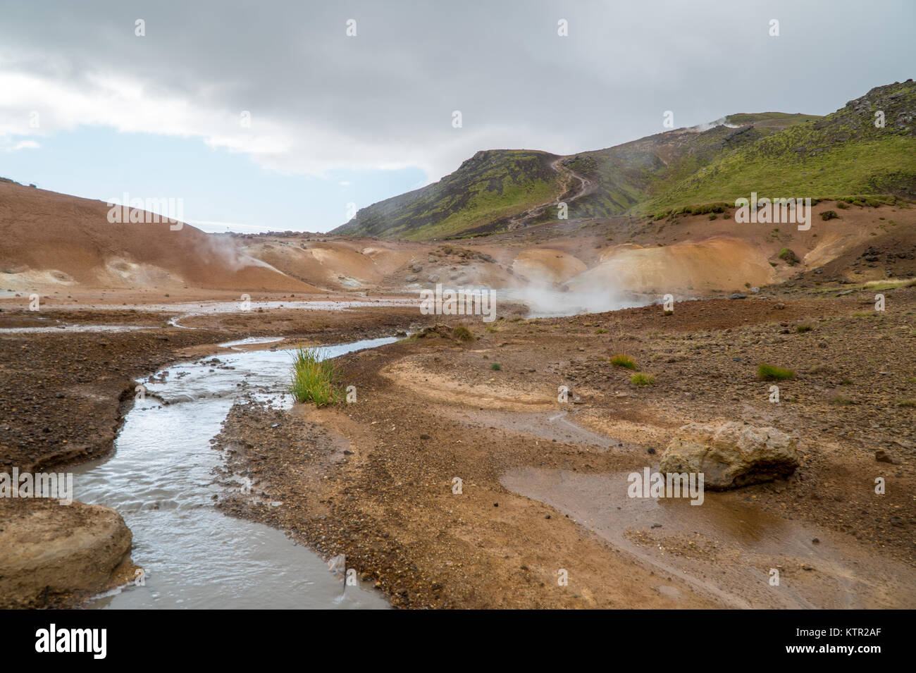 Rough geothermal fields of Krysuvik in Iceland with river and mountains ...