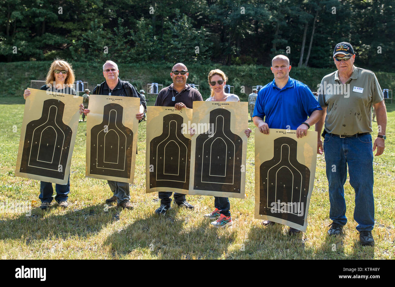 Civilian employers of New York Army National Guard Soldiers display their targets after learning how to safely handle and fire an M9 pistol from trainers from the 106th Regional Training Institute, New York Army National Guard, as part of a &quot;Boss Lift&quot; at Camp Smith, N.Y., Sept. 10, 2016.   The Boss Lift program, run by the Employer Support of the Guard and Reserve (ESGR), invites employers from companies that employ National Guardsmen, or prospective employers, to spend a day working with Soldiers to understand what their employees' drill weekends and service entails. (U.S. Army Nat Stock Photo