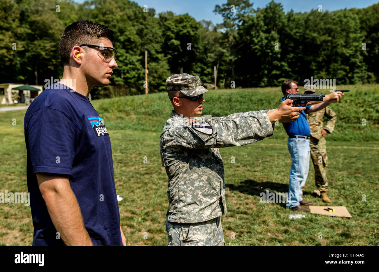 A civilian employer of an New York Army National Guard Soldier learns how to safely handle and fire an M9 pistol with trainers from the 106th Regional Training Institute, New York Army National Guard, as part of a &quot;Boss Lift&quot; at Camp Smith, N.Y., Sept. 10, 2016,   The Boss Lift program, run by the Employer Support of the Guard and Reserve (ESGR), invites employers from companies that employ National Guardsmen, or prospective employers, to spend a day working with Soldiers to understand what their employees' drill weekends and service entails. (U.S. Army National Guard photo by Sgt. H Stock Photo