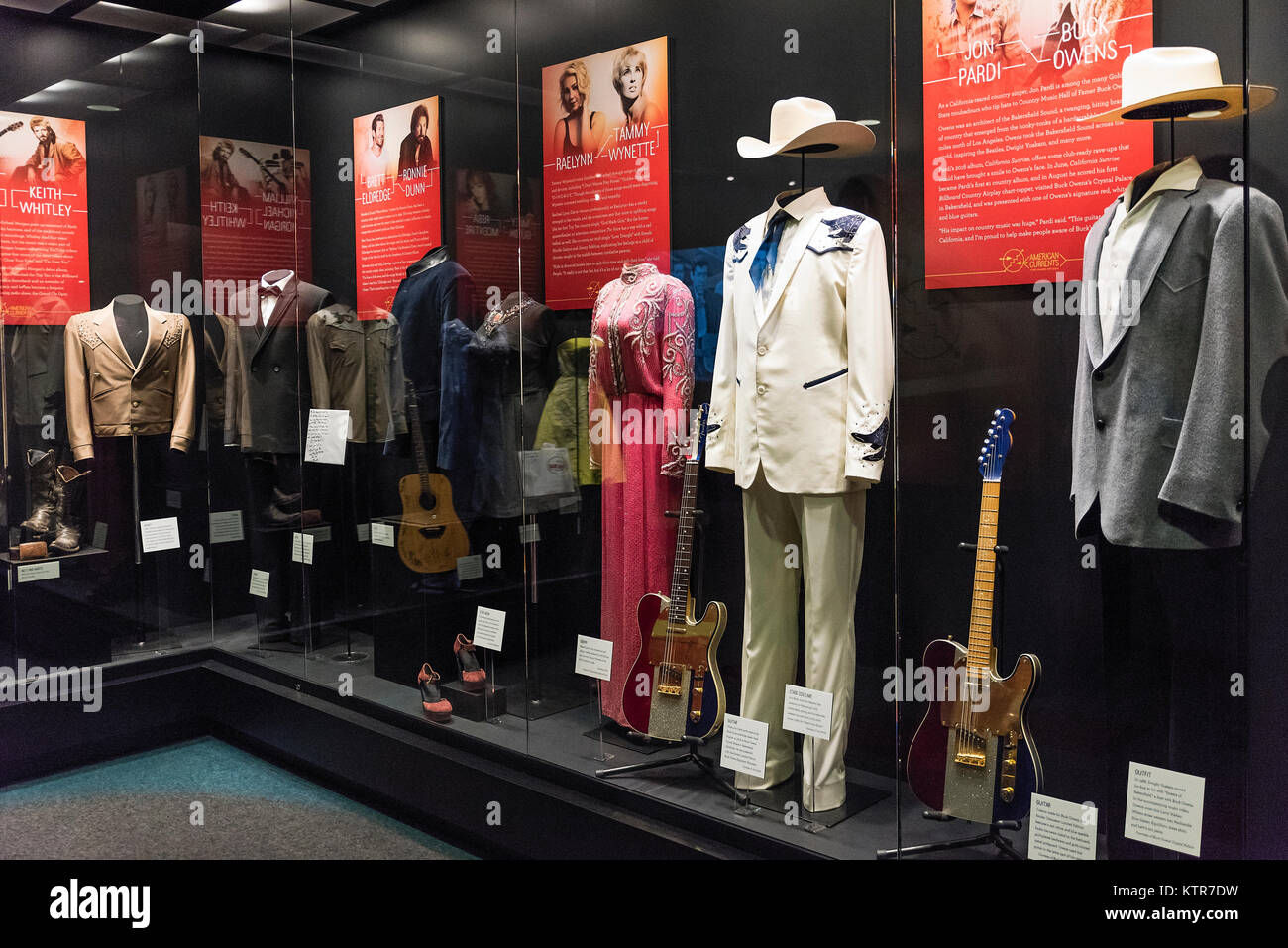 Exhibit of stage clothing from various country music stars, Country Music Hall of Fame, Nashville, Tennessee, USA. Stock Photo