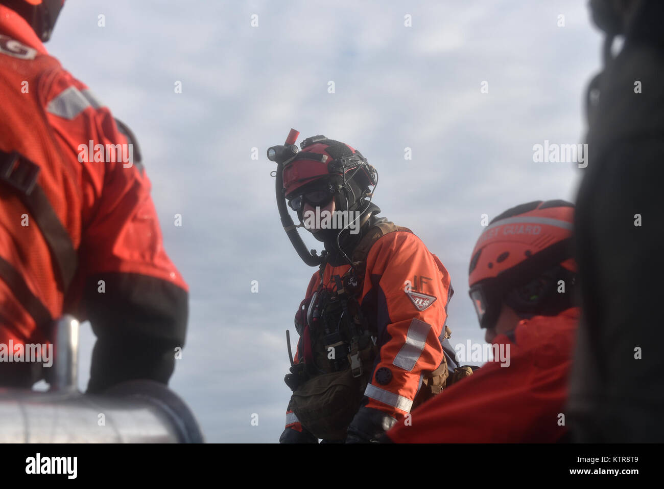 HAMPTON BAYS, NY - Airmen with 101st Rescue Squadron and 103rd Rescue Squadron conduct hoist training with United States Coastguardsmen from  US Coast Guard Station Shinnecock December 22, 2016.  During this training, Guardian Angels from the 103rd RQS were lowered via hoist from an HH-60 Pavehawk onto the cutter's deck. After that, the aircraft practiced dropping and removing patient litters, before hoisting the Guardian Angels back up and returning to base.  (US Air National Guard / Staff Sergeant Christopher S. Muncy / released) Stock Photo