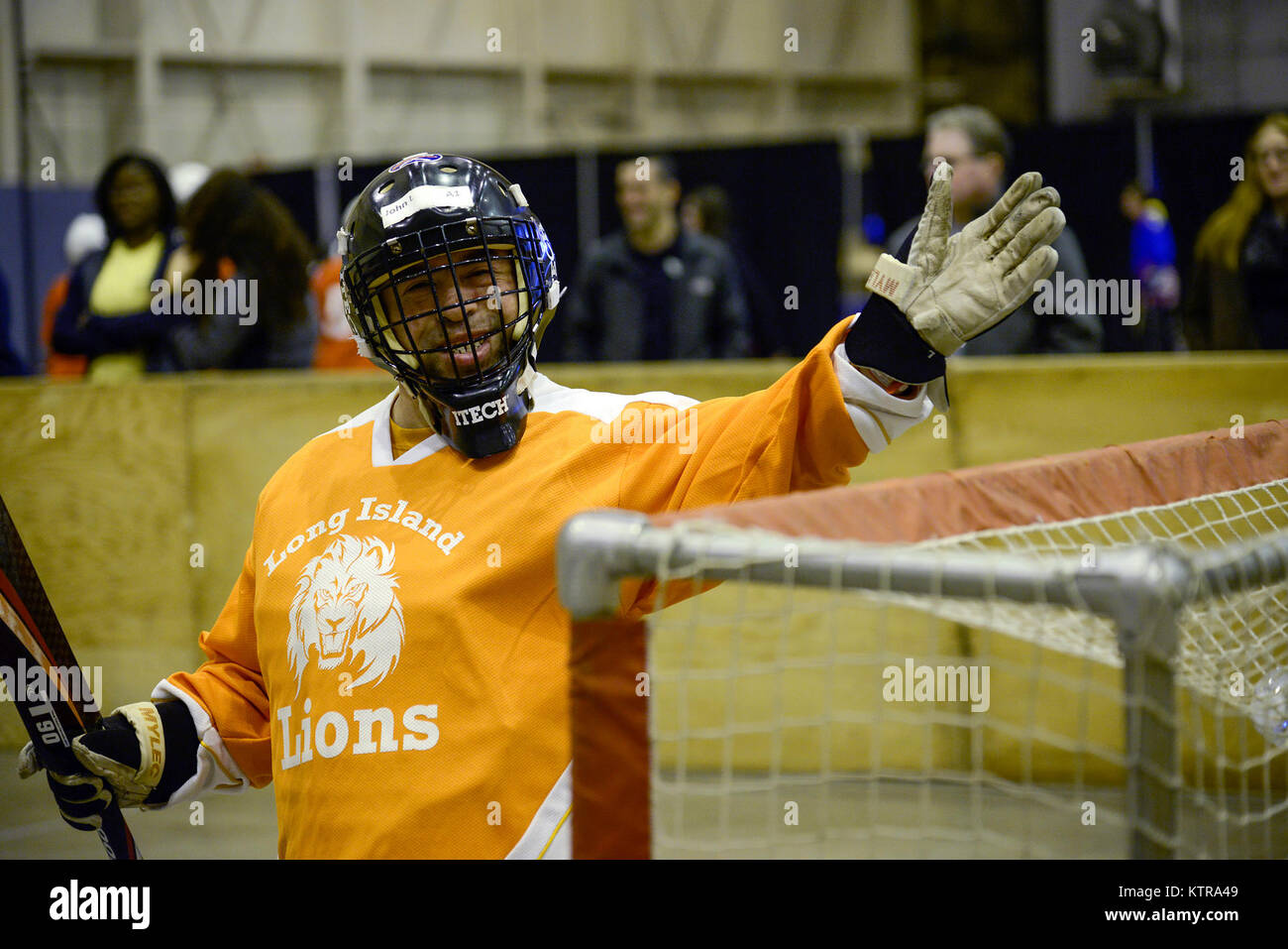A Goalie Waves Between Periods Of A Special Olympics Of New York