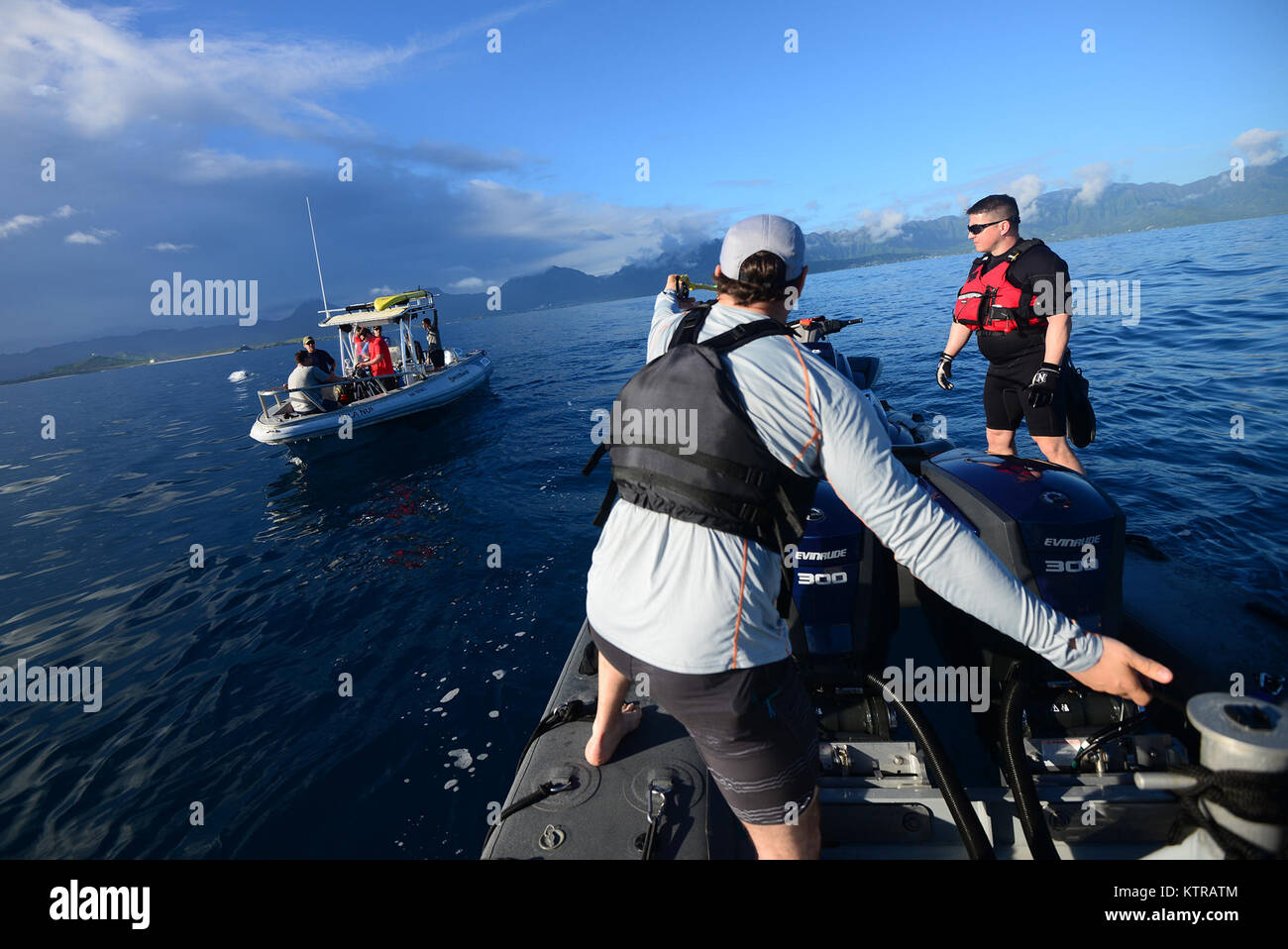 The "Front Porch" flotation device is unfolded and inflated by Pararescuemen and Combat Rescue