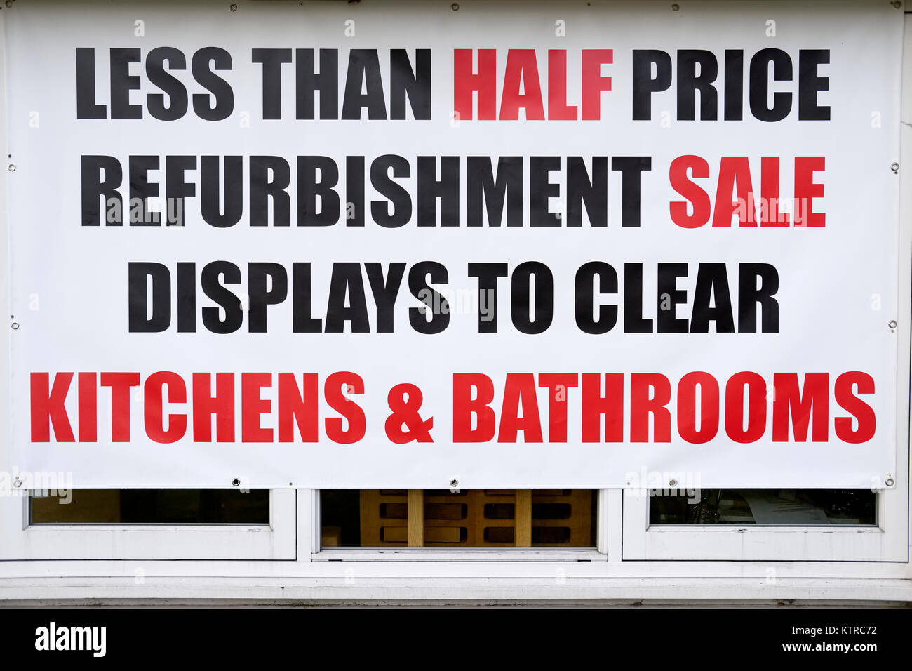 Half Price Sale Sign Banner in Window Kitchens Bathrooms Stock Photo