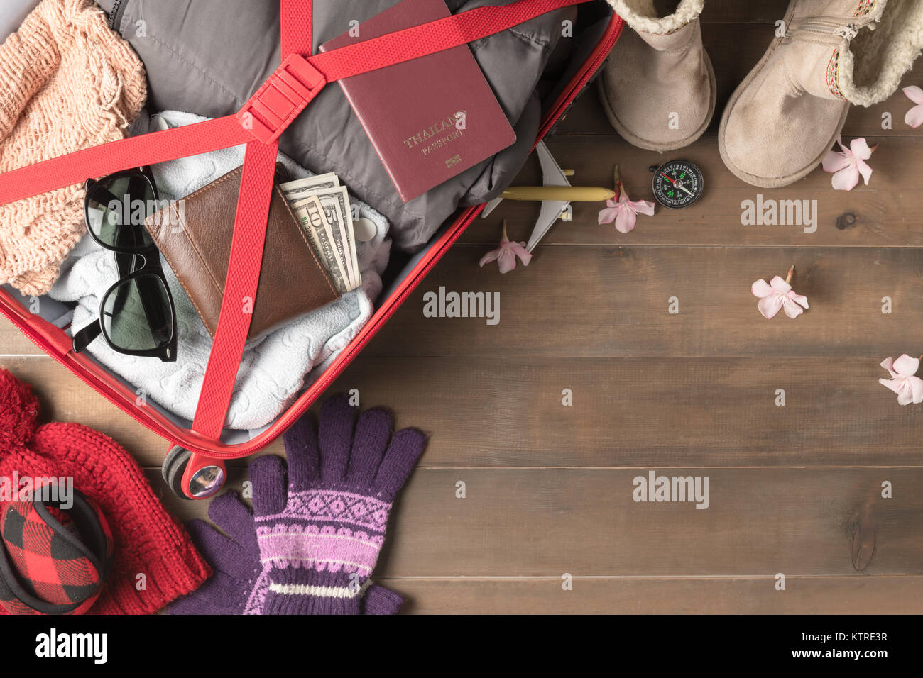 prepare accessories and travel items for winter trip on old wooden ...