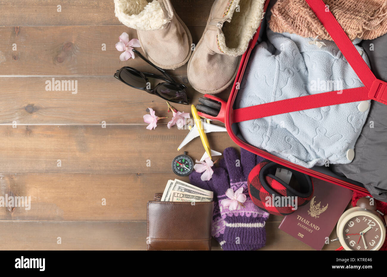 prepare accessories and travel items for winter trip on old wooden ...