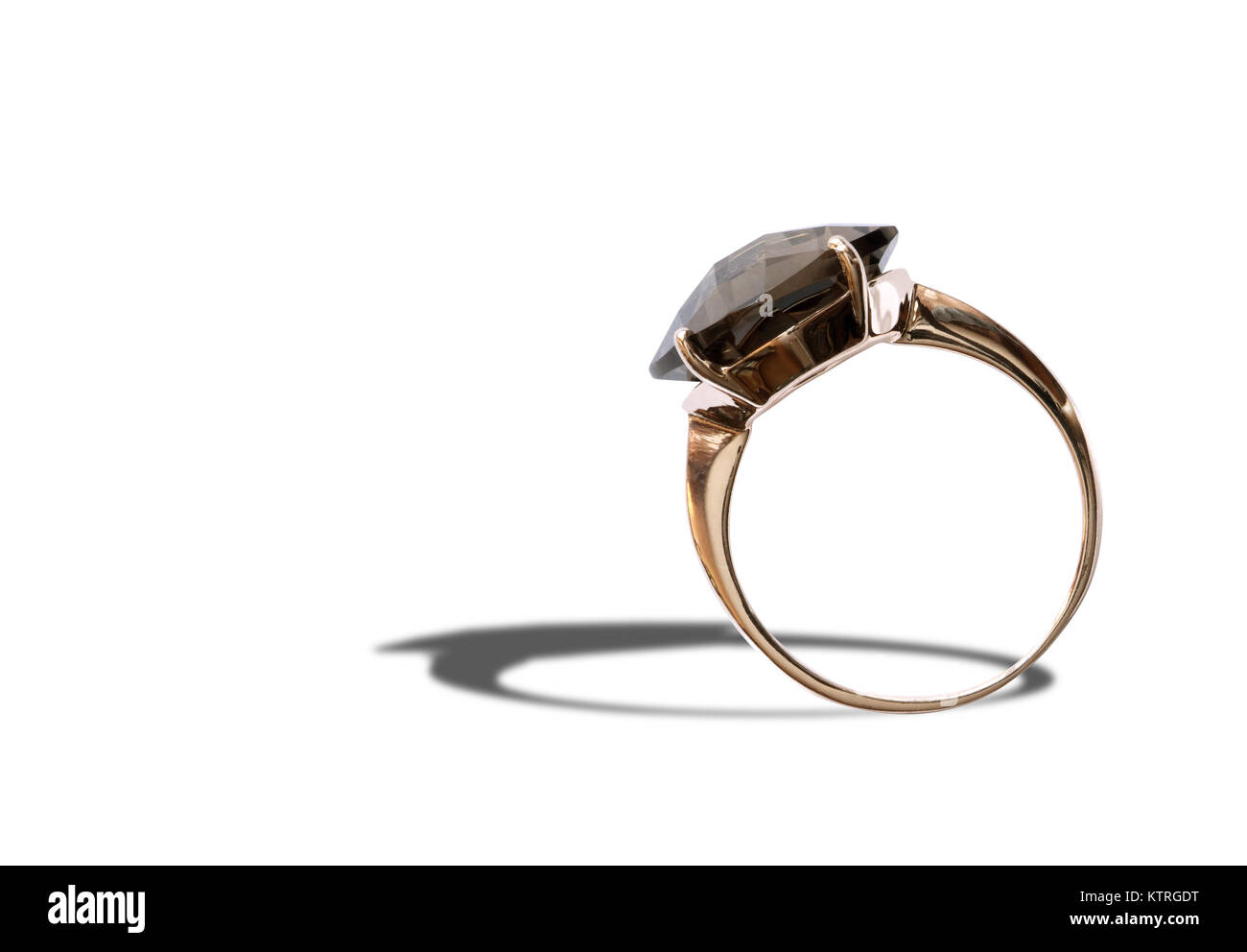 Gold ring with black precious stone isolated on white background. Clipping path is included Stock Photo