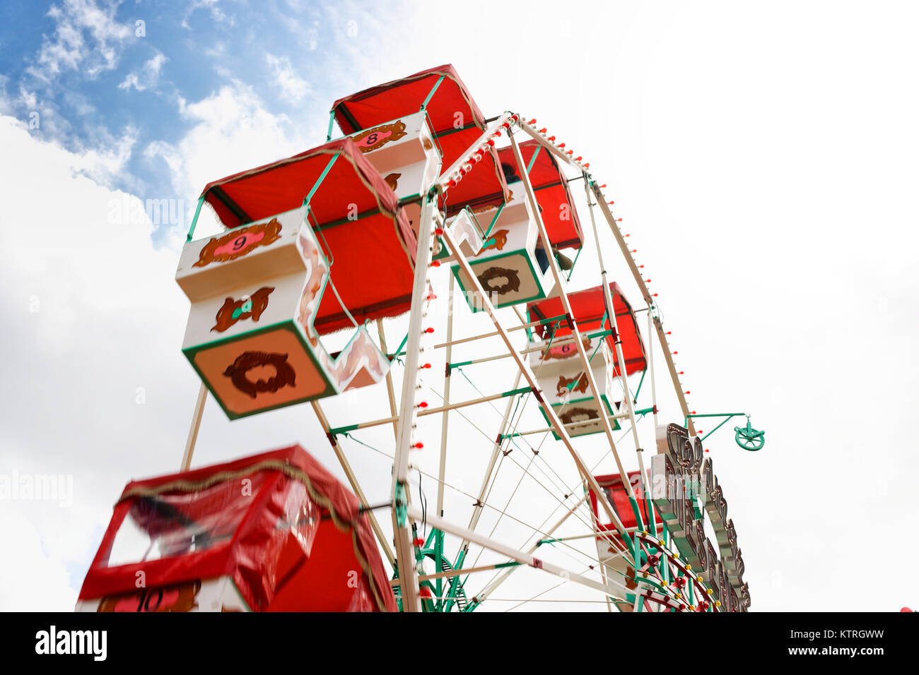 Part of a ferris wheel on a funfair at a sunny day. Stock Photo