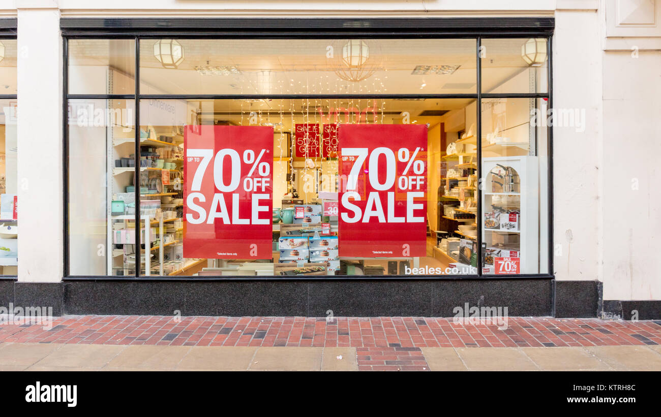 Worthing, Sussex, UK; 26 December 2017; Department Store Window With Two Large Sale Signs Affixed Stock Photo