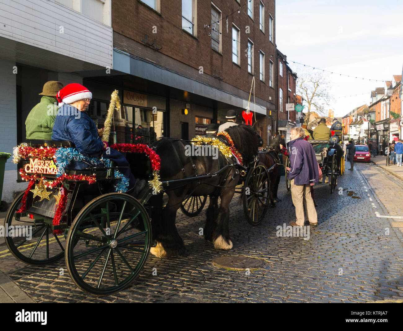 Horse drawn Carriages waiting in St Mary's Street Newport Shropshire England UK taking part in Albrighton and Woodland Hunt Boxing Day gathering Stock Photo