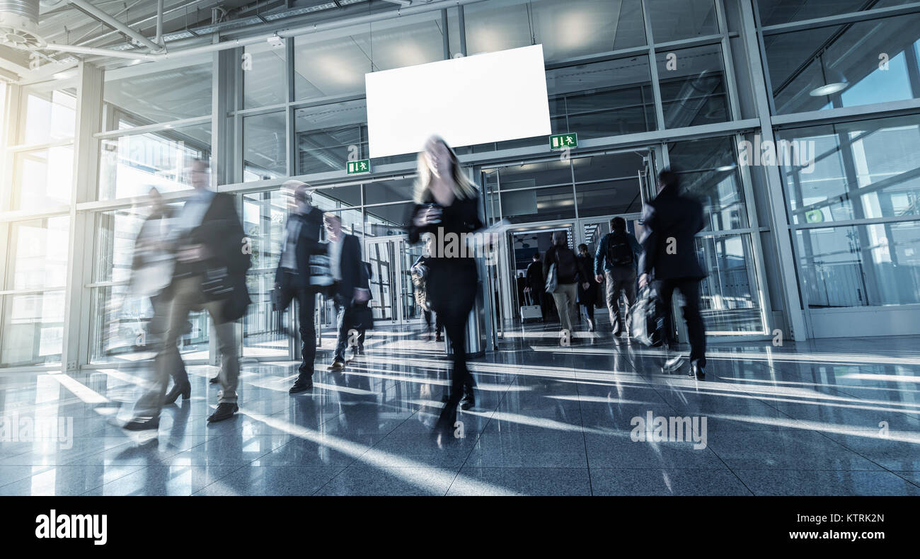 blurred business people walking in a modern hall Stock Photo - Alamy