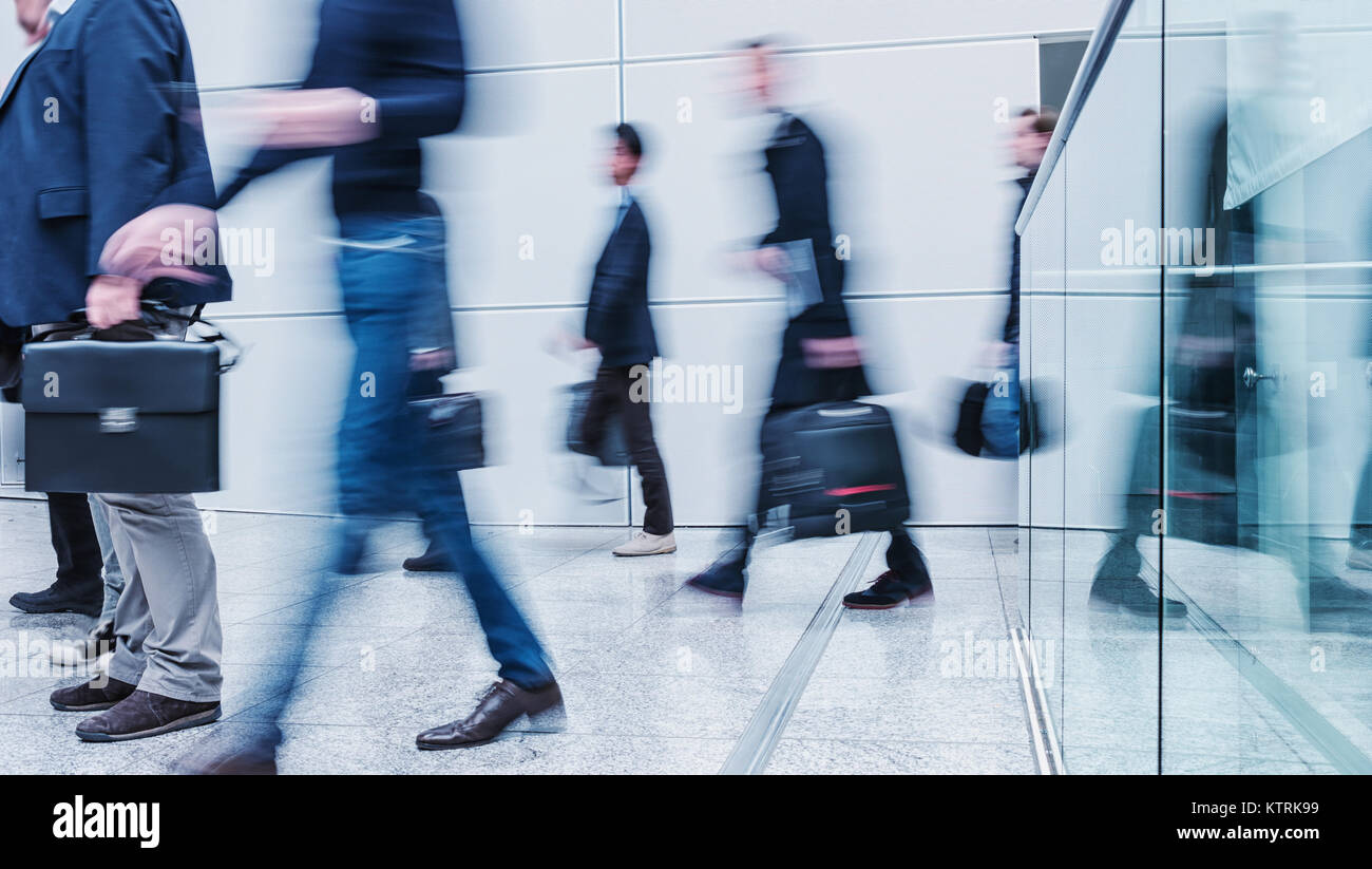 Blurred business people walking Stock Photo - Alamy