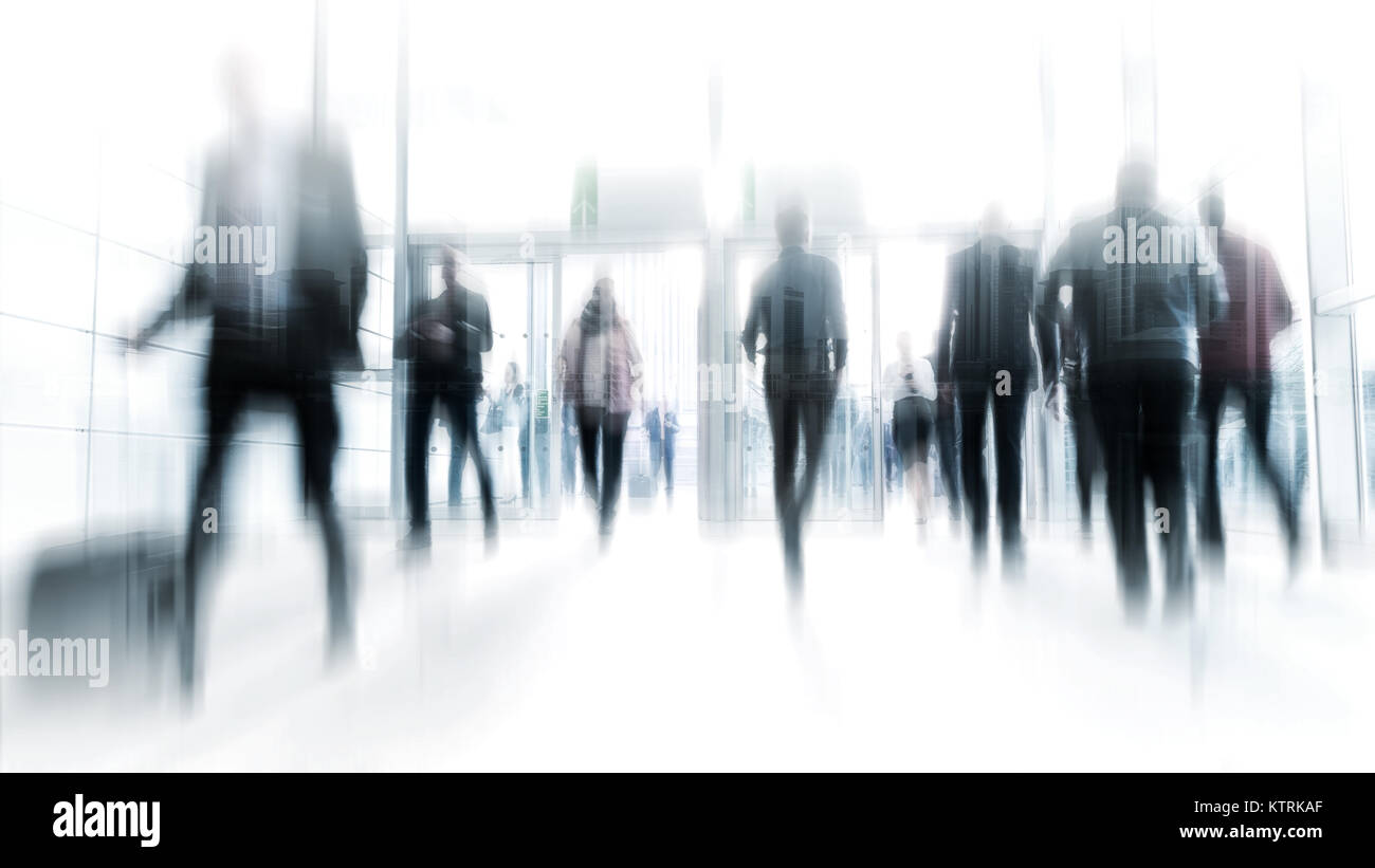 abstakt image of business people in the lobby with a blurred background ...