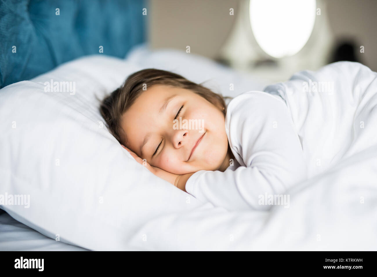 Little girl sleeping peacefully in her bright lit room Stock Photo - Alamy