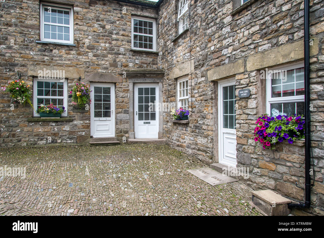 Corner where two stone houses meet in Dent, Yorkshire, England Stock