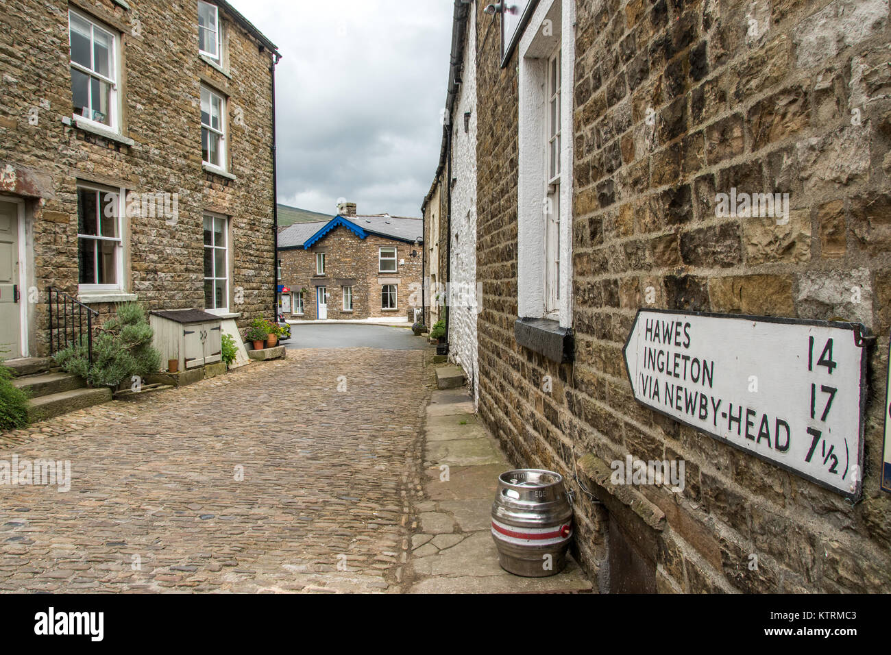 Street lined with quaint stone houses, Dent, Yorkshire, England Stock