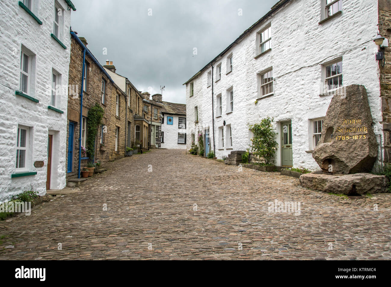 Street lined with quaint stone houses, Dent, Yorkshire, England Stock