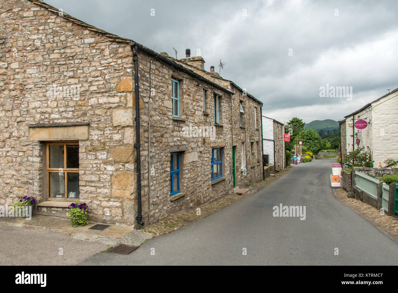 Street lined with quaint stone houses, Dent, Yorkshire, England Stock