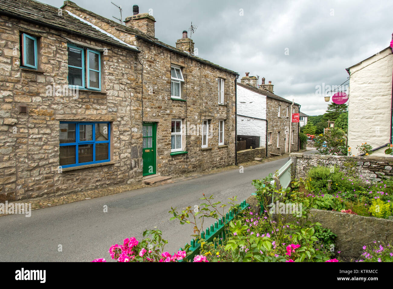 Street lined with quaint stone houses, Dent, Yorkshire, England Stock