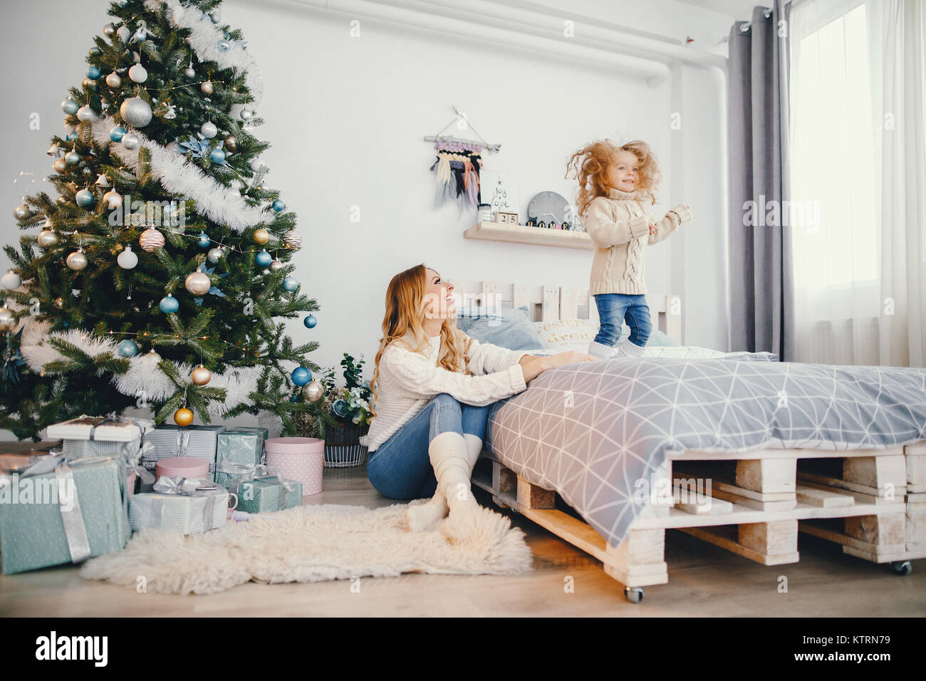 baby girl jumping on the bed Stock Photo Alamy