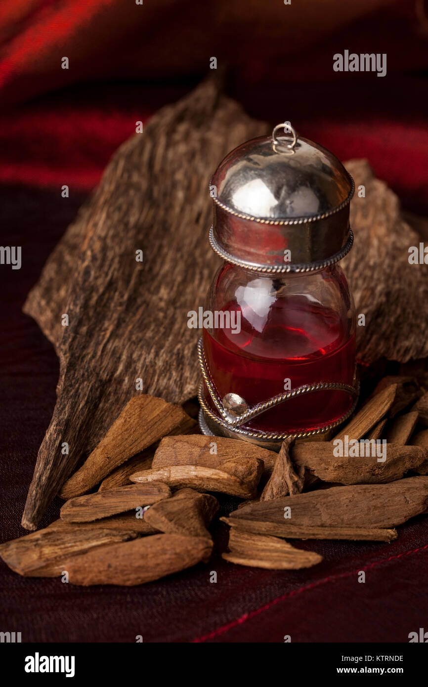 Agarwood, also called aloeswood, oil and incense chips Stock Photo