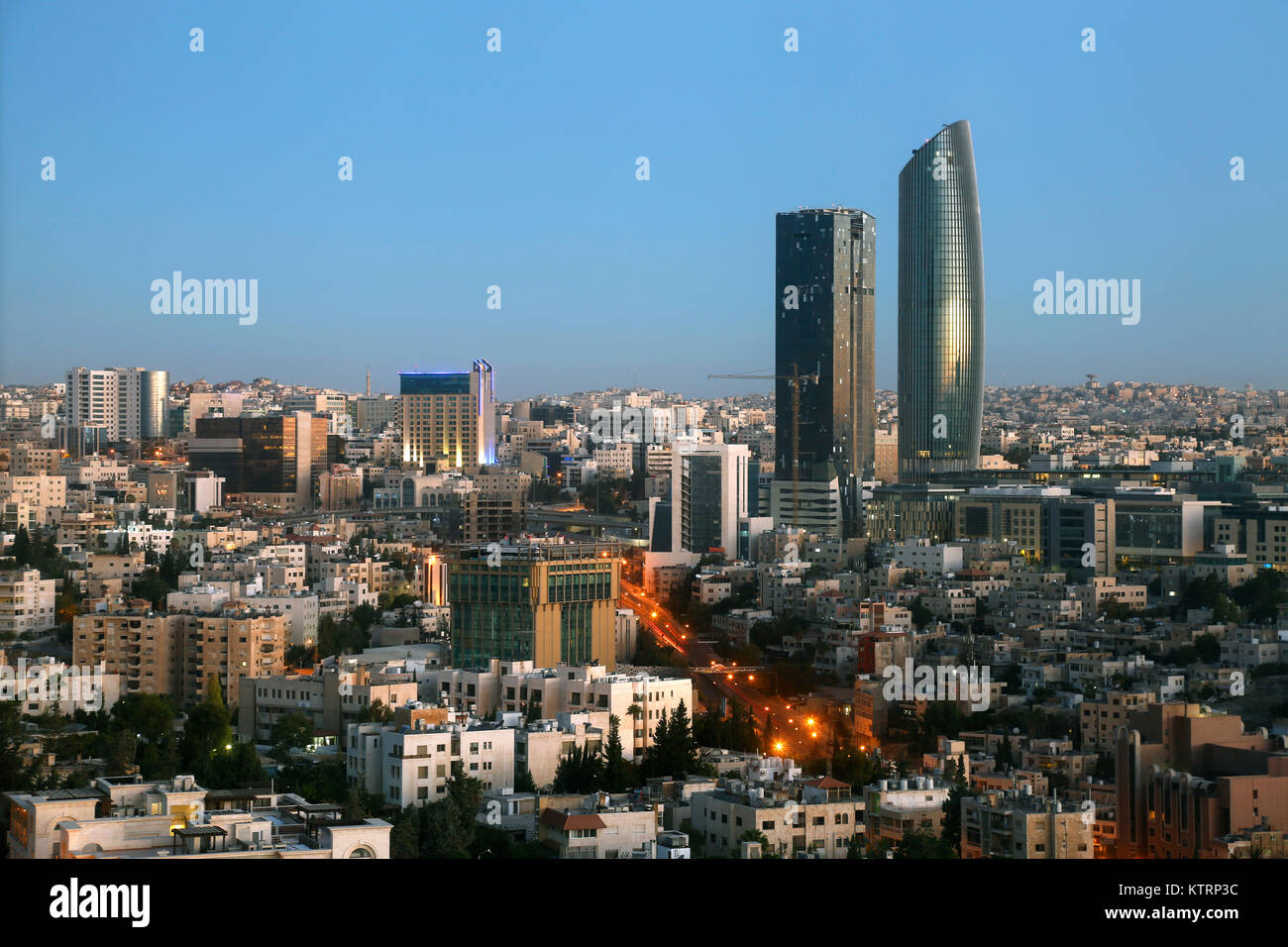 the new downtown of Amman skyline at night before sunrise Stock Photo