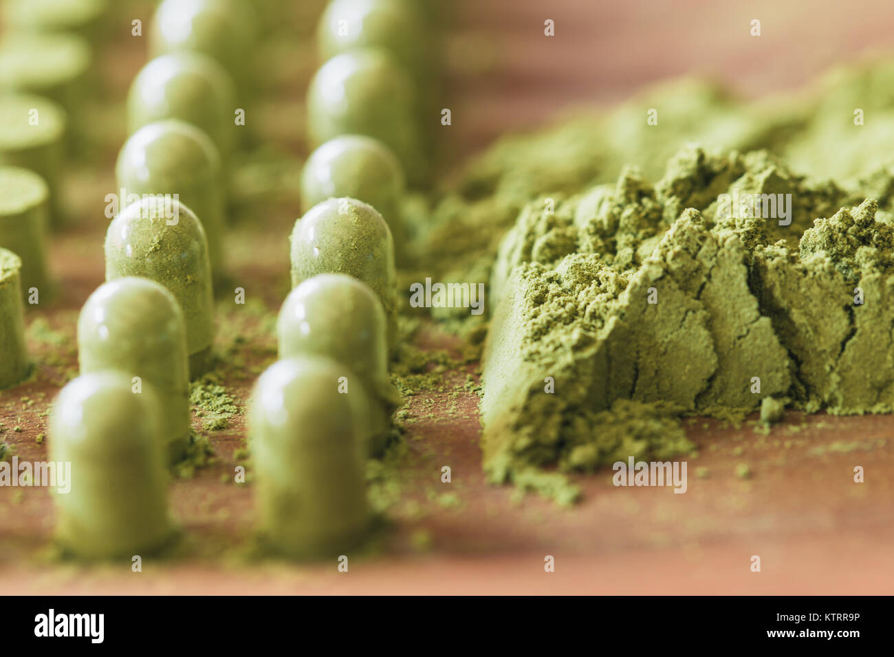 Kariyat Herbal medicine green powder herbs packing in capsules with traditional process hand tool Stock Photo