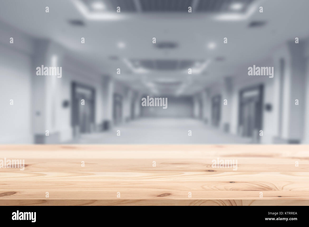 Wood foreground with blur interior modern building background design for display products Stock Photo