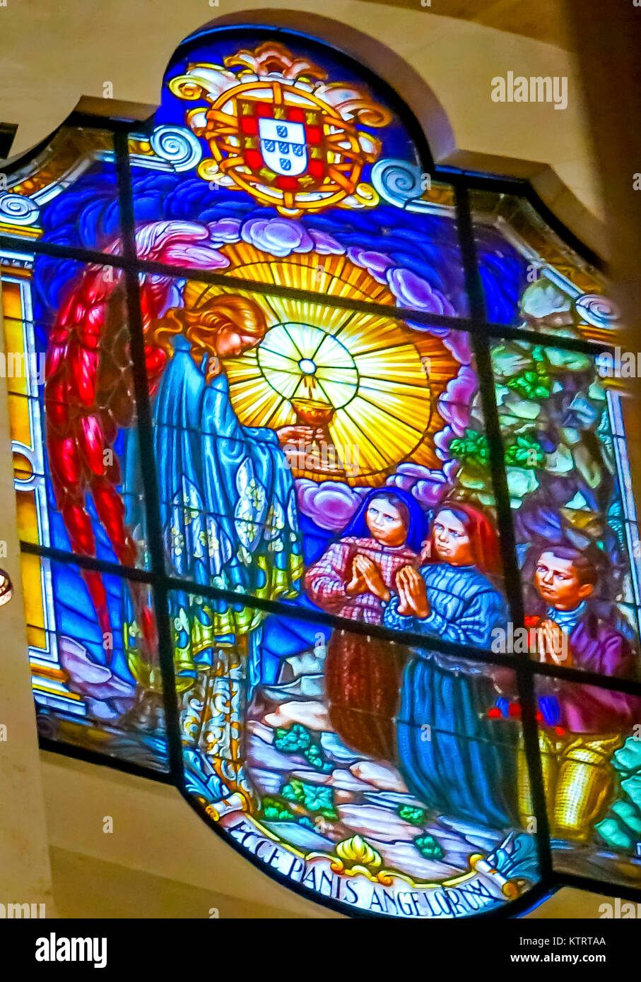 Three Peasant Children Angel Stained Glass Basilica of Lady of Rosary Fatima Portugal. Church created on site where three Portuguese Shepherd children Stock Photo
