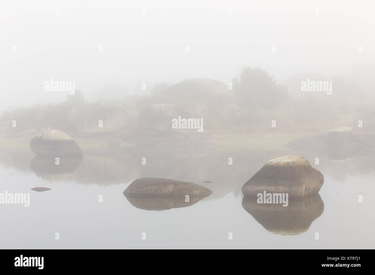 Fog on a lake in the natural park of the Barruecos. Spain. Stock Photo