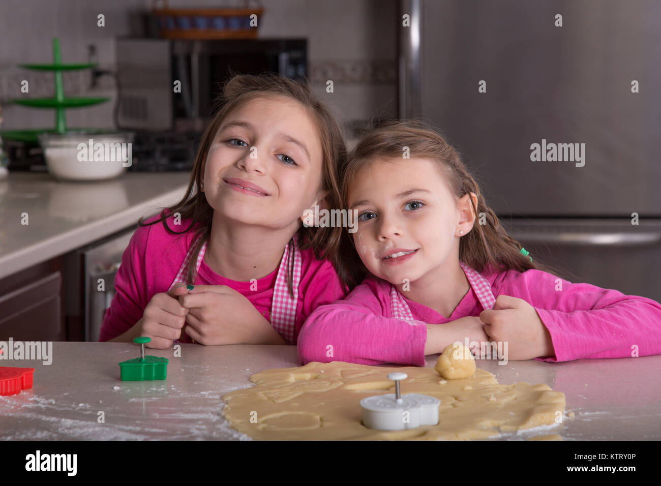 Young girls making Christmas cookies Stock Photo Alamy