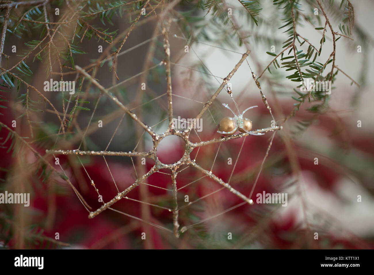 Ukrainian  spider and web traditional ornament on a Christmas tree based on Christmas story. Stock Photo