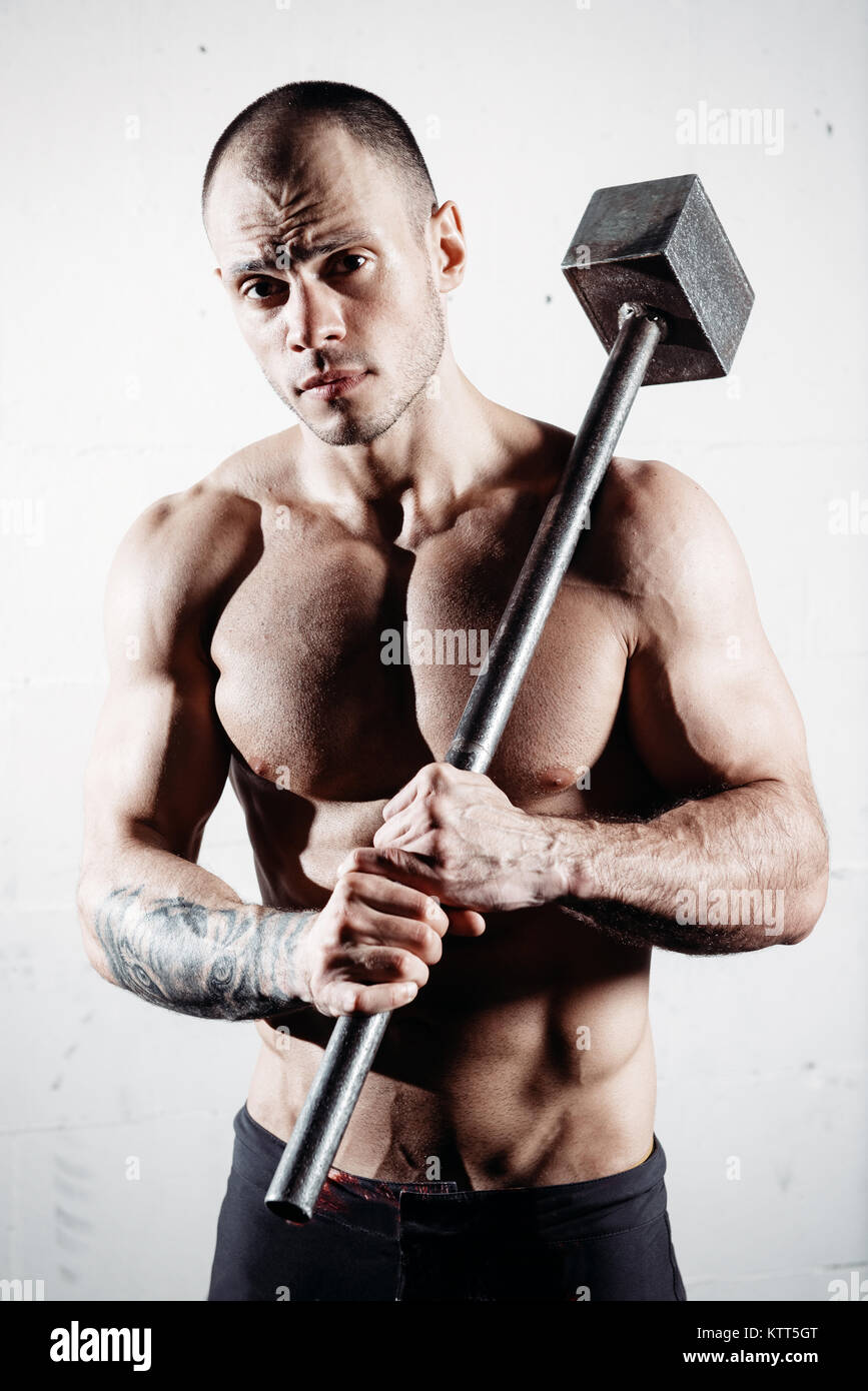 Portrait Of A Shirtless Man Holding A Gym Sledgehammer Stock Photo Alamy