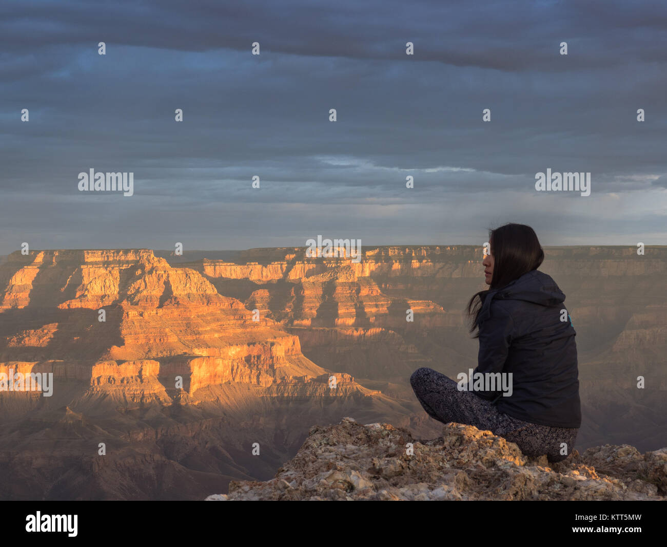 Woman looking at Grand Canyon in the morning, Arizona, United States ...