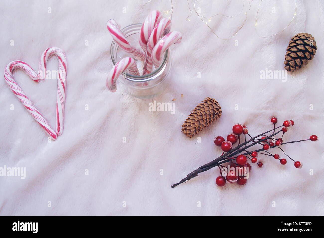 Candy canes in a glass jar with decorations Stock Photo Alamy